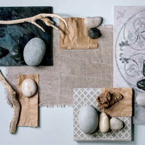 Creative layout abstract geometry squares by nature materials paper, textile, ceramics with stones and dry branches. Flat lay. Space for any products. Advertising eco-friendly concept